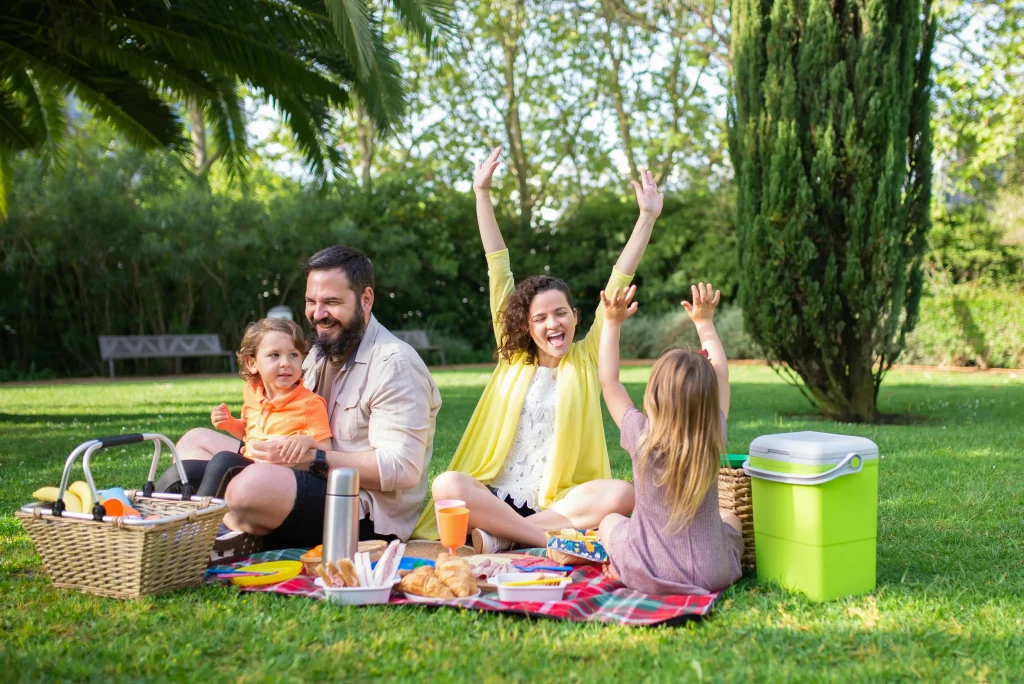 family enjoying picnic in park